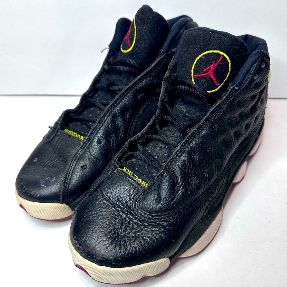 Used Black Air Jordan 13 Sneakers with Red and Yellow Accents